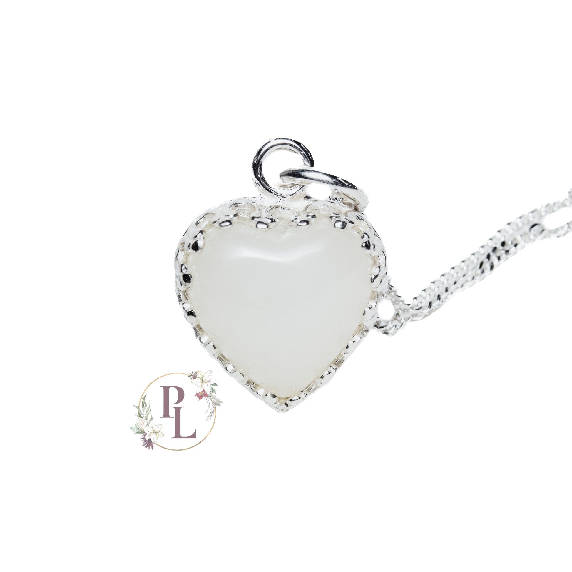 Adeline Crowned Heart Breastmilk Necklace by Pandora Lilly Keepsakes - A milky off-white heart shaped stone, encased in a 925 Sterling Silver setting with crowned edging, attached to an eighteen inch long curb chain.