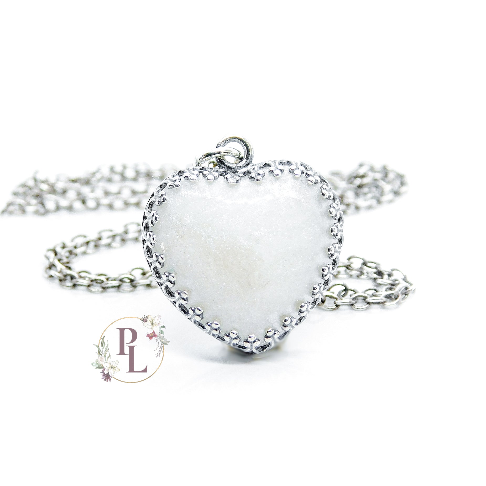Adeline Crowned Heart Breastmilk Necklace by Pandora Lilly Keepsakes - A milky off-white heart shaped stone, encased in a 925 Sterling Silver setting with crowned edging, attached to an eighteen inch long curb chain.